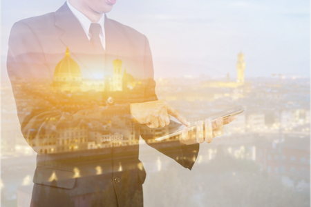 Double exposure,Young handsome Persian businessman,Start Up Programming. Website designer working digital tablet dock keyboard and computer laptop with smart phone,Florence italy,vintage colorの写真素材