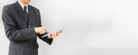 Young handsome Persian businessman using digital tablet,for bannerの写真素材