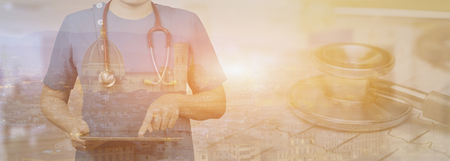 healthcare,Male doctor or medical students or surgeon,anesthesiologists using tablet during the conference,Health Check with digital system support for patient, Double exposureの写真素材