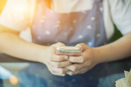 businesswoman working with modern devices, student girl using digital tablet computer and mobile smart phone,business concept,selective focus,vintage colorの写真素材