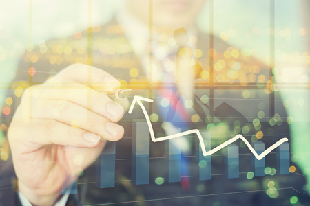 Businessman Hand drawing a stairs in a Conceptual Image with a strategy marketing plan to be successful in his business growth and graph progress ,vintage ,double exposure concept Businessman Hand drawing a stairs in a Conceptual Image with a strategy marketing plan to be successful in his business growth and graph progress ,vintage ,double exposure concept