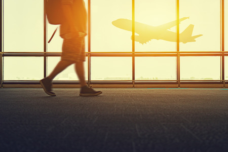 travel trip in airport concept, Motion of Business man at international airports moving to terminal gate for airplane - aerospace industry flight connections,selective focus,vintage tone colorの写真素材