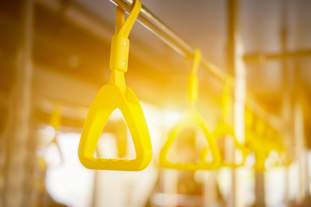 Handle on ceiling of bus, a train, MRT, prevent toppling.underground railway system,vintage color ,copy spaceの写真素材