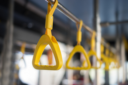 Handle on ceiling of bus, a train, MRT, prevent toppling.underground railway system,vintage color ,copy spaceの写真素材