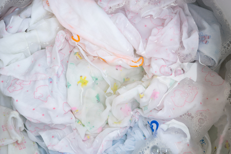 washing color clothes in basin,selective focusの写真素材