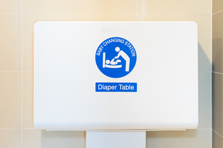 Baby's diaper table changing cloth station install in the wall at the airport restroom,selective focusの写真素材