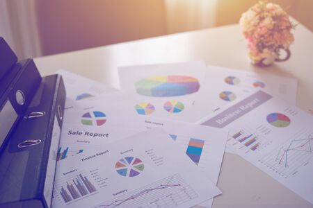 new plan financial graph data on office table with laptop and digital tablet for Business team colleagues discussing,vintage colorの写真素材