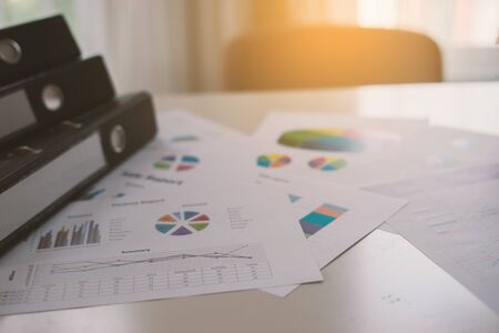 new plan financial graph data on office table with laptop and digital tablet for Business team colleagues discussing,vintage colorの写真素材