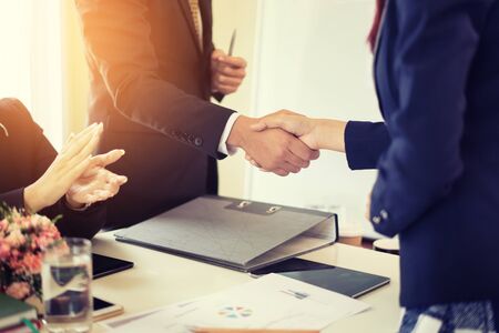 Business partnership marketing meeting concept. Image businessmans handshake. Successful businessmen handshaking after good deal.vintage color, Discussing Together Startup Idea.Working Online Projectの写真素材