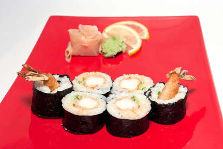 Sushi on a plate next to the gingerの写真素材