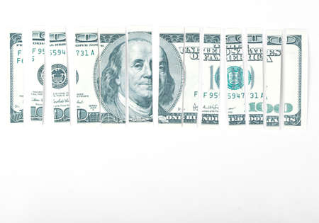 Many parts of one hundred dollar on whiteの写真素材