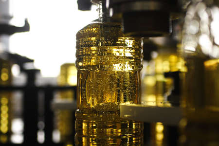 Sunflower oil in plastic bottles in the plantの写真素材