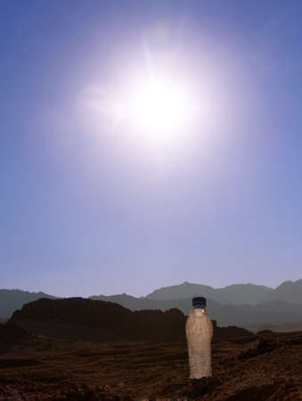 empty bottle of water in the desertの写真素材