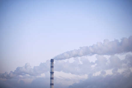 smoke from the chimney on the skyの写真素材