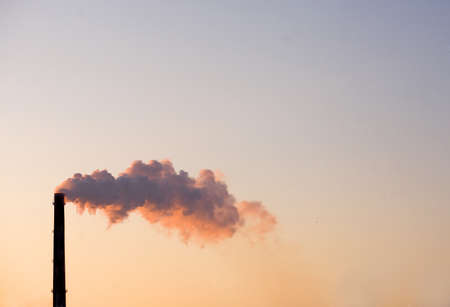 smoke from the chimney on the skyの写真素材