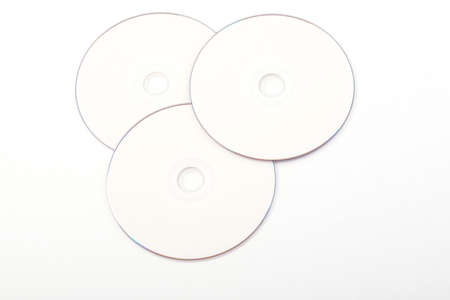 Pile of Many CDs or DVDs on white