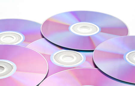 Pile of Many CDs or DVDs on whiteの写真素材
