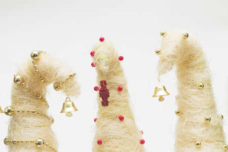 Shiny miniature Christmas trees made of sisal with beadsの写真素材