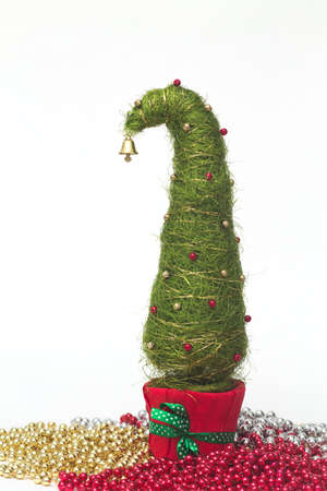 Shiny miniature Christmas tree made of sisal with beadsの写真素材