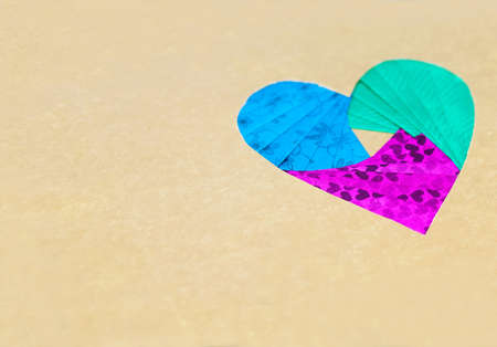 tricolor multicolored paper hearth on a silver backgroundの写真素材