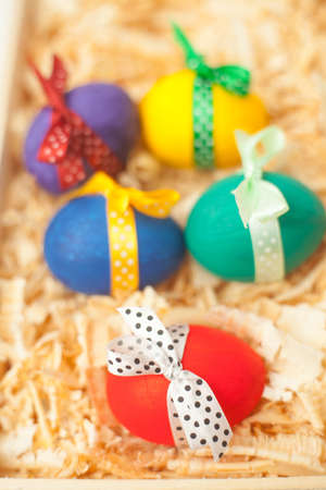 colorful easter eggs with sawdustの写真素材