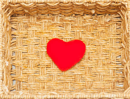 small plush heart on the wickerworkの写真素材