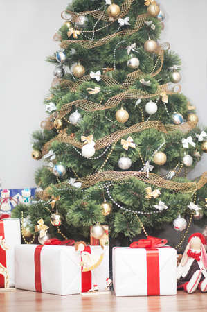 colorful shot of a Christmas tree with gift boxesの写真素材