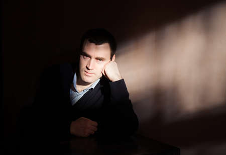 Young man suffering from a severe depressionの写真素材