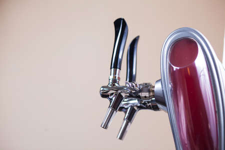 Beer taps in a bar for spilling drinksの写真素材