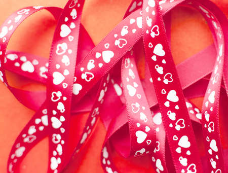 gift ribbon with heart on red paper