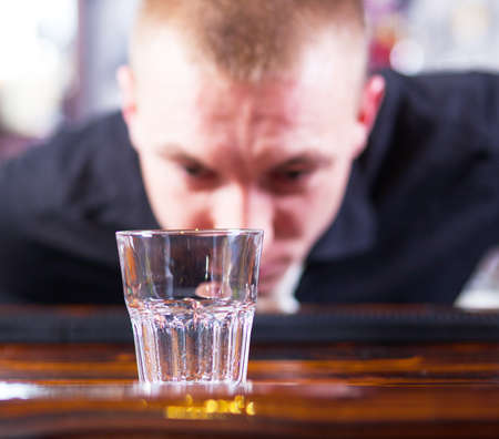 Young  professional barman in action making cocktail drinksの写真素材