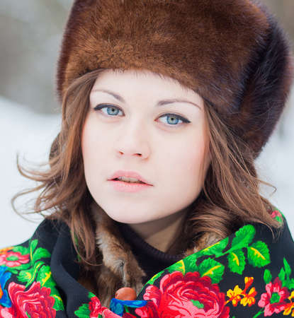 Portrait of a beautiful girl in a fur hat