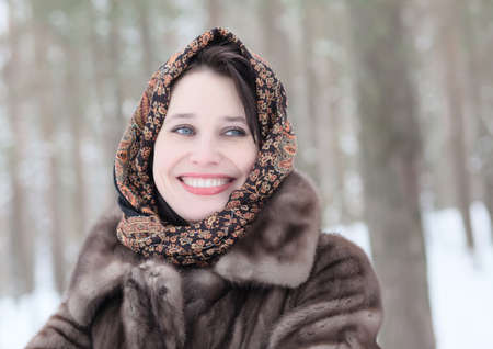beautiful woman in winter parkの写真素材