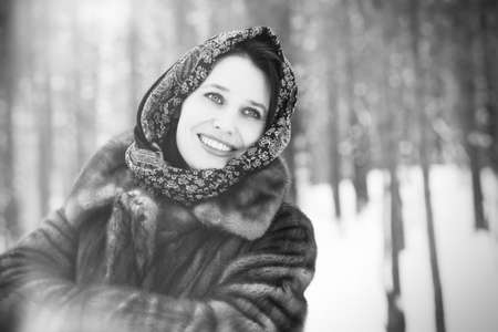 beautiful woman in winter parkの写真素材