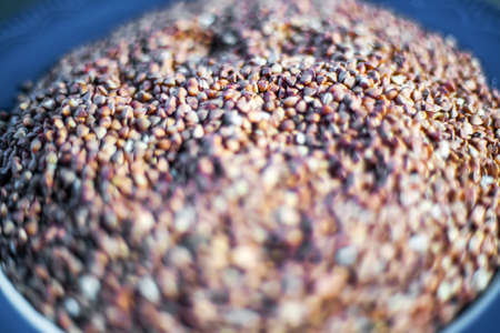 Buckwheat in blue bowl and closeupの写真素材