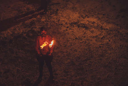 Beauty fire show in the darkの写真素材