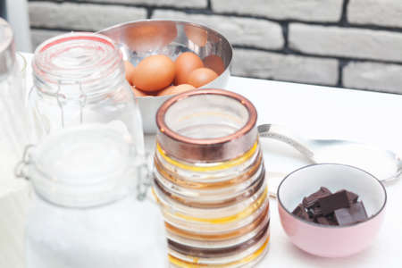 iingredients and tools to make a cake in the kitchenの写真素材