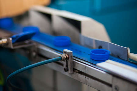 The production line of plastic corks, blue color