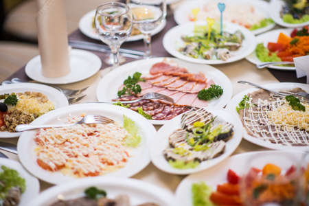 Lots appetizers on a table in a restaurant.の写真素材