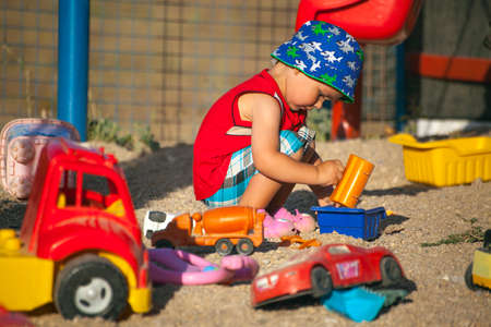 DIDIM, TURKEY - JULY 9, 2014. Little boy playing on the playground in summer.のeditorial素材