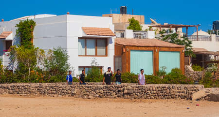 SHARM EL SHEIKH, EGYPT - JULY 9, 2009. local men walking on the street.のeditorial素材