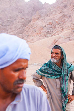 SHARM EL SHEIKH, EGYPT - JULY 9, 2009.Two bedouin are in the desert.のeditorial素材