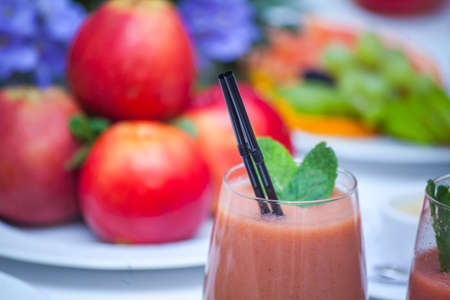 Healthy red smoothie and ingredients - superfoods, detox, diet, health, vegetarian food conceptの写真素材