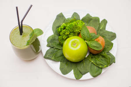 Healthy green smoothie and ingredients - superfoods, detox, diet, health, vegetarian food conceptの写真素材