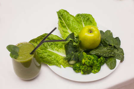 Healthy green smoothie and ingredients - superfoods, detox, diet, health, vegetarian food conceptの写真素材