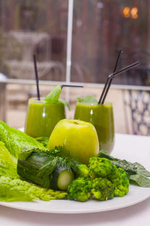 Healthy green smoothie and ingredients - superfoods, detox, diet, health, vegetarian food conceptの写真素材