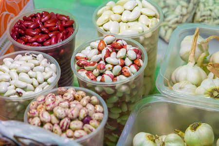 Beans and garlic are sold in the vegetable market. High quality photo