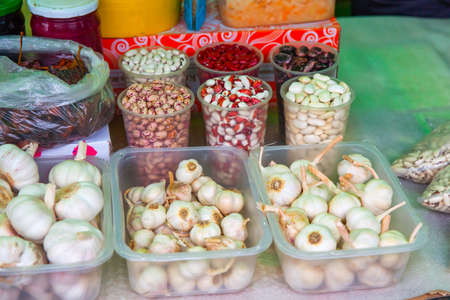 Beans and garlic are sold in the vegetable market. High quality photo