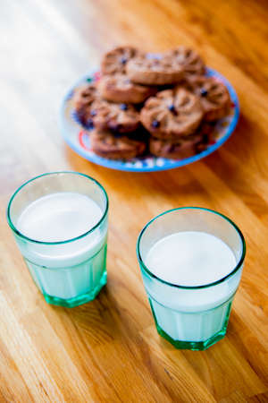 lots of freshly baked oatmeal cookies with milk. High quality photo