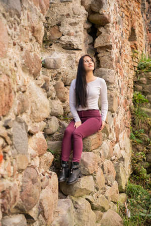 beautiful young girl posing near the riverの写真素材
